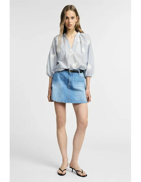 Jupe courte en denim effet usé à cinq poches Please