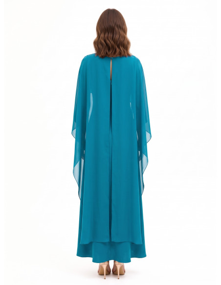 Long, flowing dress in structured satin with a Rinascimento-style georgette cape