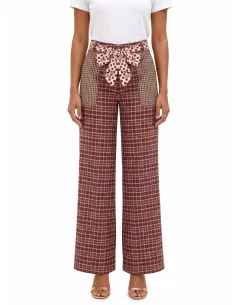 Patchwork-style palazzo trousers with a logoed Rinascimento scarf at the waist