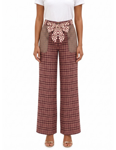 Patchwork-style palazzo trousers with a logoed Rinascimento scarf at the waist