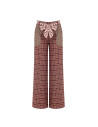 Patchwork-style palazzo trousers with a logoed Rinascimento scarf at the waist