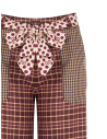 Patchwork-style palazzo trousers with a logoed Rinascimento scarf at the waist